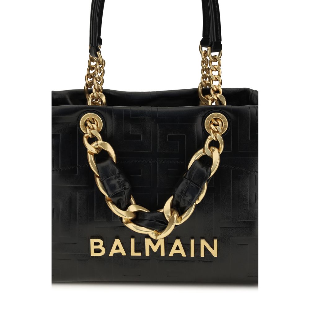 Balmain black calf leather Bos Taurus shoulder bag with gold-tone hardware and structured design.