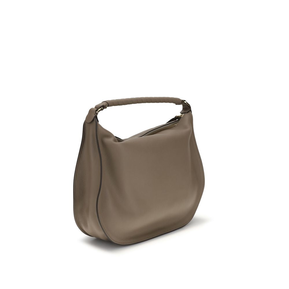 Chloé beige calf leather Bos Taurus shoulder bag with gold-tone hardware and adjustable strap on a plain background.