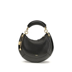 Chloé black calf leather Bos Taurus shoulder bag with gold-tone hardware and adjustable strap.