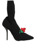 Black Dolce & Gabbana stiletto heels with mid-calf boot design, featuring sleek leather and elegant pointed toes.
