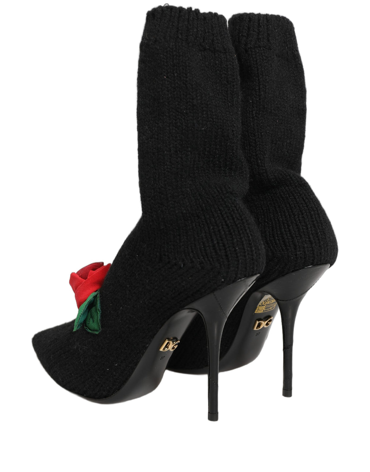 Dolce & Gabbana black stiletto heels with mid-calf boots, sleek leather shoes with pointed toes and high heels.