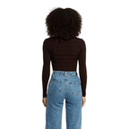 Brown Morgan De Toi viscose turtleneck sweater displayed on a hanger, showcasing its soft fabric and classic fit.
