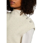 Morgan De Toi beige sleeveless polyester sweater, lightweight and casual, displayed on a hanger with a neutral background.