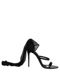 Black Dolce & Gabbana stiletto sandals with socks and knee-high boots, featuring a stylish and elegant design.