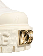 Dolce & Gabbana white leather ankle boots with rubber logo detail and stylish design.