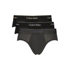 Black cotton men's briefs by Calvin Klein, featuring a comfortable elastic waistband and classic design.