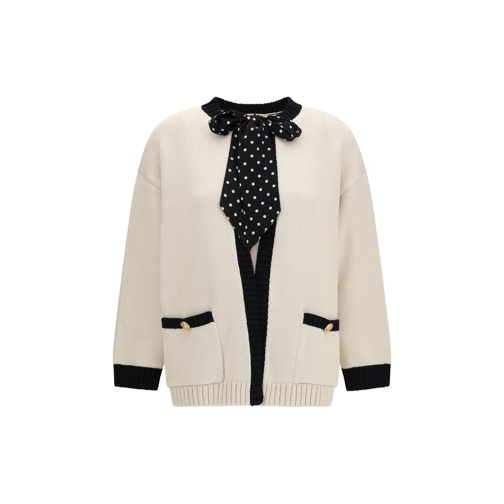 Beige cotton cardigan by Valentino Garavani with button closures and ribbed cuffs, displayed on a neutral background.