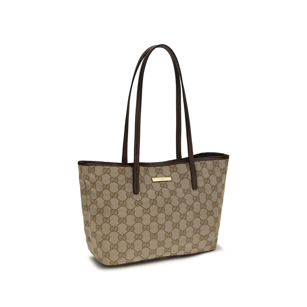 Gucci beige fabric handbag with gold-tone hardware and structured design, showcasing elegant craftsmanship and stylish details.