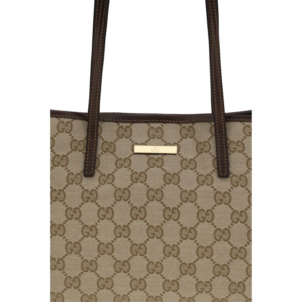 Gucci beige fabric handbag with top handles and subtle logo detailing, stylish and elegant accessory for everyday use.