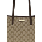 Gucci beige fabric handbag with top handles and subtle logo detailing, stylish and elegant accessory for everyday use.
