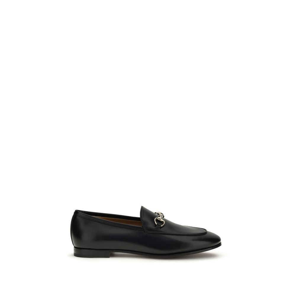 Gucci black calf leather Bos Taurus slip-on loafers with sleek design and elegant stitching, perfect for stylish casual wear.