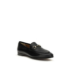 Gucci black calf leather Bos Taurus slip-on loafers showing sleek design and smooth leather finish.