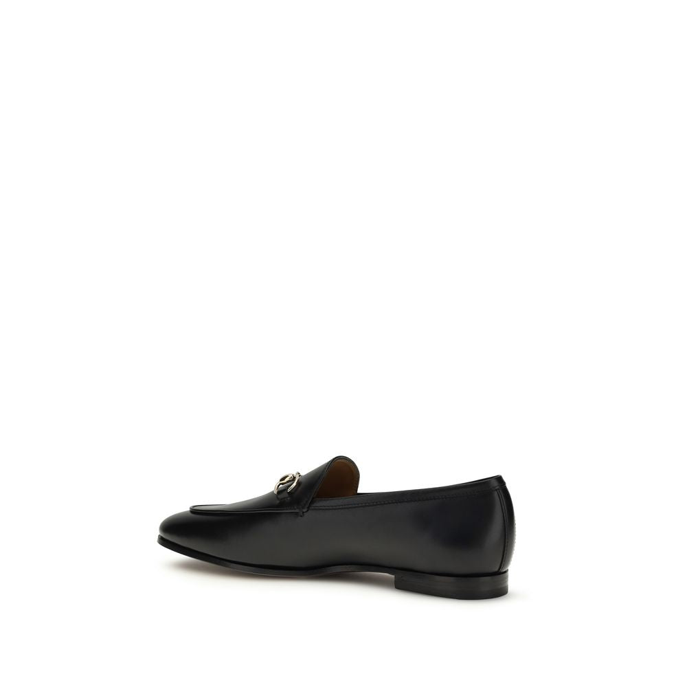 Gucci Black Calf Leather Bos Taurus Slip-On Loafers featuring sleek design and classic craftsmanship.