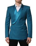 Dolce & Gabbana teal wool double-breasted formal coat blazer with notch lapels and front buttons displayed on a hanger.
