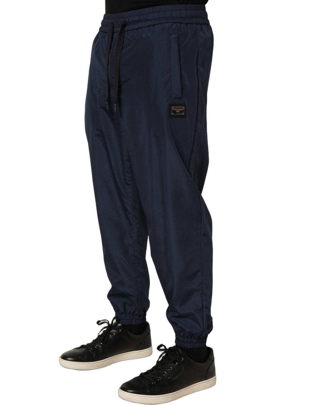 Dark blue polyester jogger sweatpants from Dolce & Gabbana with elastic waistband and relaxed fit, styled with side pockets.