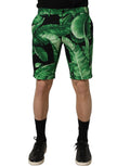 Dolce & Gabbana black and green banana leaf men's Bermuda shorts with tropical print and relaxed fit.