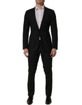 Dark gray wool slim fit formal men's suit by Dolce & Gabbana, featuring a tailored 2-piece design with classic lapels and buttons.
