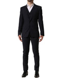 Dolce & Gabbana black wool slim fit 3-piece men's formal suit, featuring a jacket, vest, and trousers on a hanger.