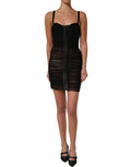 Dolce & Gabbana black bodycon fitted corset-style mini dress shown on model, highlighting sleek silhouette and elegant design.