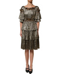 Dolce & Gabbana metallic gold embellished tiered midi dress with intricate detailing and flowing silhouette.