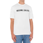 White cotton Moschino T-shirt with logo print, casual fit, short sleeves, and round neckline.