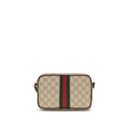 Gucci beige fabric shoulder bag with adjustable strap and subtle logo details on front.