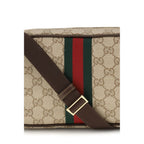 Gucci beige fabric shoulder bag with adjustable strap and subtle logo detailing, stylish and versatile accessory.