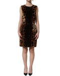Dolce & Gabbana brown leopard sleeveless sheath mini dress displayed on a hanger with a fitted silhouette and animal print fabric.
