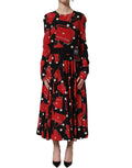 Dolce & Gabbana black handbag print long sleeve midi dress displayed on a model with elegant styling.