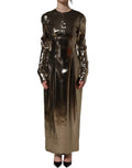 Dolce & Gabbana metallic gold polyester long-sleeve maxi dress displayed on a model. Elegant evening wear with shiny finish.