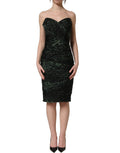 Dolce & Gabbana green leopard print bustier draped midi dress displayed on a model with flowing fabric and elegant design.