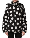 Dolce & Gabbana black and white polka dot hooded blouson jacket showing the polka dot pattern and hood detail.