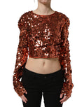 Red sequined long sleeve crop blouse by Dolce & Gabbana featuring sparkly embellishments and a fitted design.