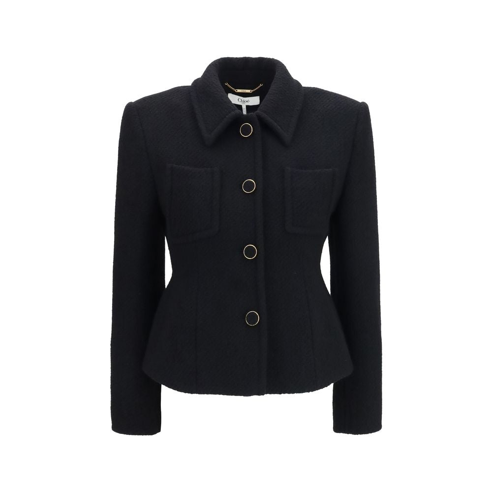 Chloé black wool blazer with a tailored fit, featuring classic lapels and structured design, ideal for a sophisticated look.