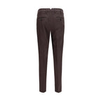 Brown cotton casual pants by Brunello Cucinelli, showing relaxed fit and detailed stitching.