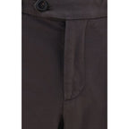 Brown cotton casual pants by Brunello Cucinelli displayed on a model, showcasing a relaxed fit and sophisticated style.