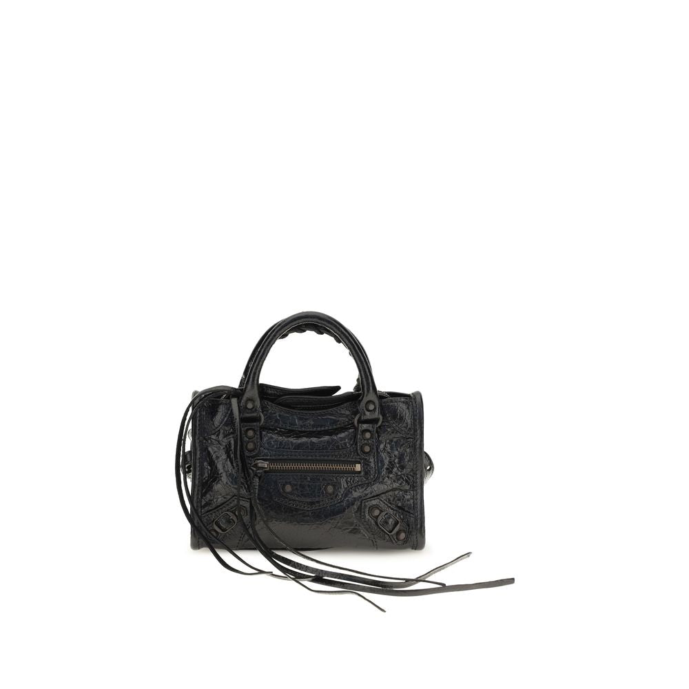 Black Lamb Ovis Aries handbag by Balenciaga featuring sleek design and structured shape with top handles and gold hardware.
