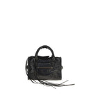 Black Lamb Ovis Aries handbag by Balenciaga featuring sleek design and structured shape with top handles and gold hardware.