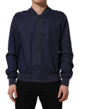 Dolce & Gabbana blue linen full-zip men's bomber jacket displayed on a hanger with a stand-up collar.