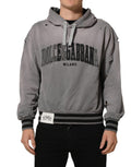 Gray Dolce & Gabbana graphic hooded sweatshirt for men with a stylish design and comfortable fit, shown on a model.
