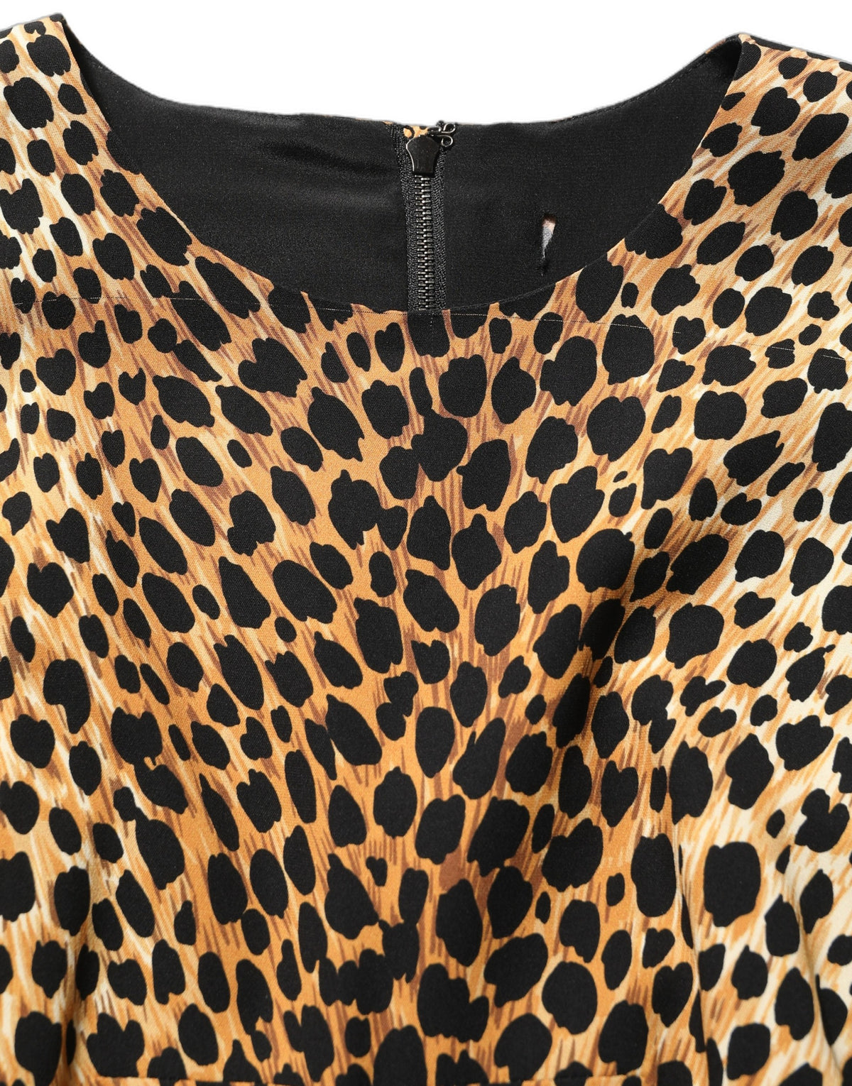 Dolce & Gabbana brown leopard print silk sheath midi dress displayed on a mannequin with a fitted silhouette and elegant style.
