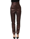 Dolce & Gabbana metallic brown high waist tapered leg pants displayed on a model, showcasing their luxurious fabric and tailored fit.