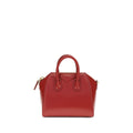 Givenchy Bos Taurus handbag made of red calf leather with silver hardware and structured design.
