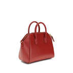 Givenchy Bos Taurus handbag made of red calf leather with silver hardware, featuring a structured design and top handle.