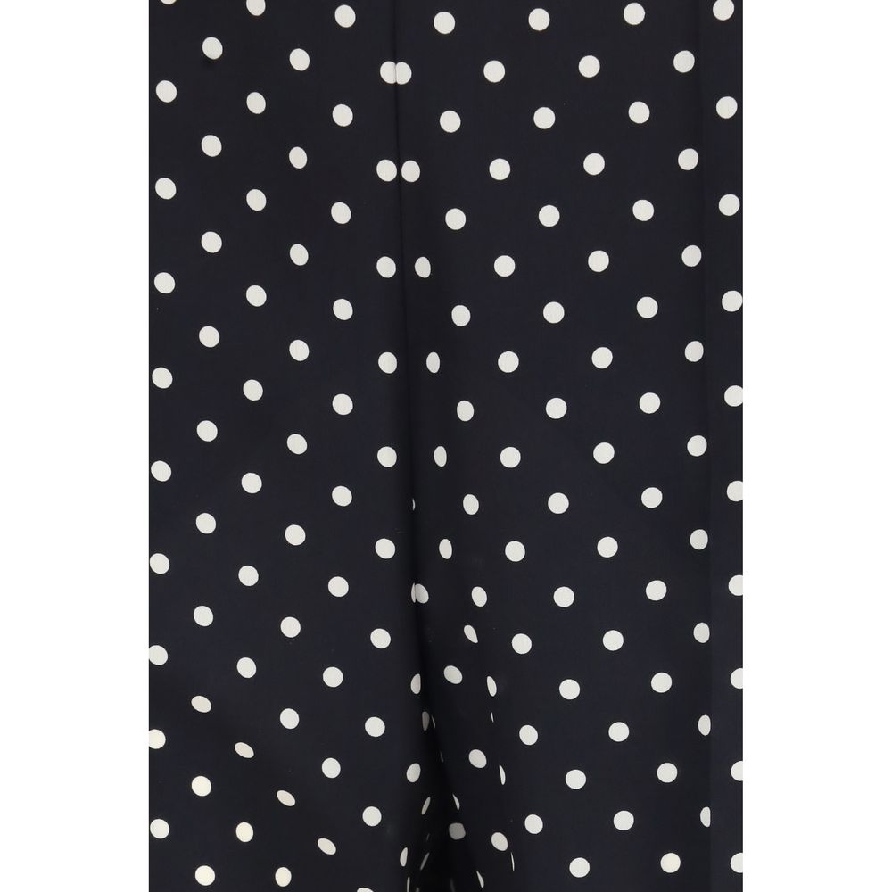 Black silk cropped pants by Valentino Garavani featuring a tailored fit and sleek style, shown on a model.