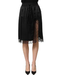 Black satin side slit skirt with lace trim from Dolce & Gabbana featuring a sleek, elegant design and flowy fabric.