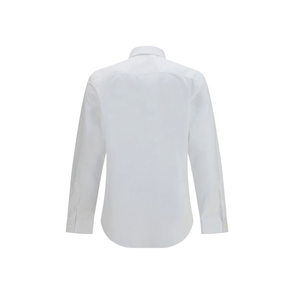 White cotton dress shirt by Burberry with a classic collar and button-down front, displayed on a hanger.