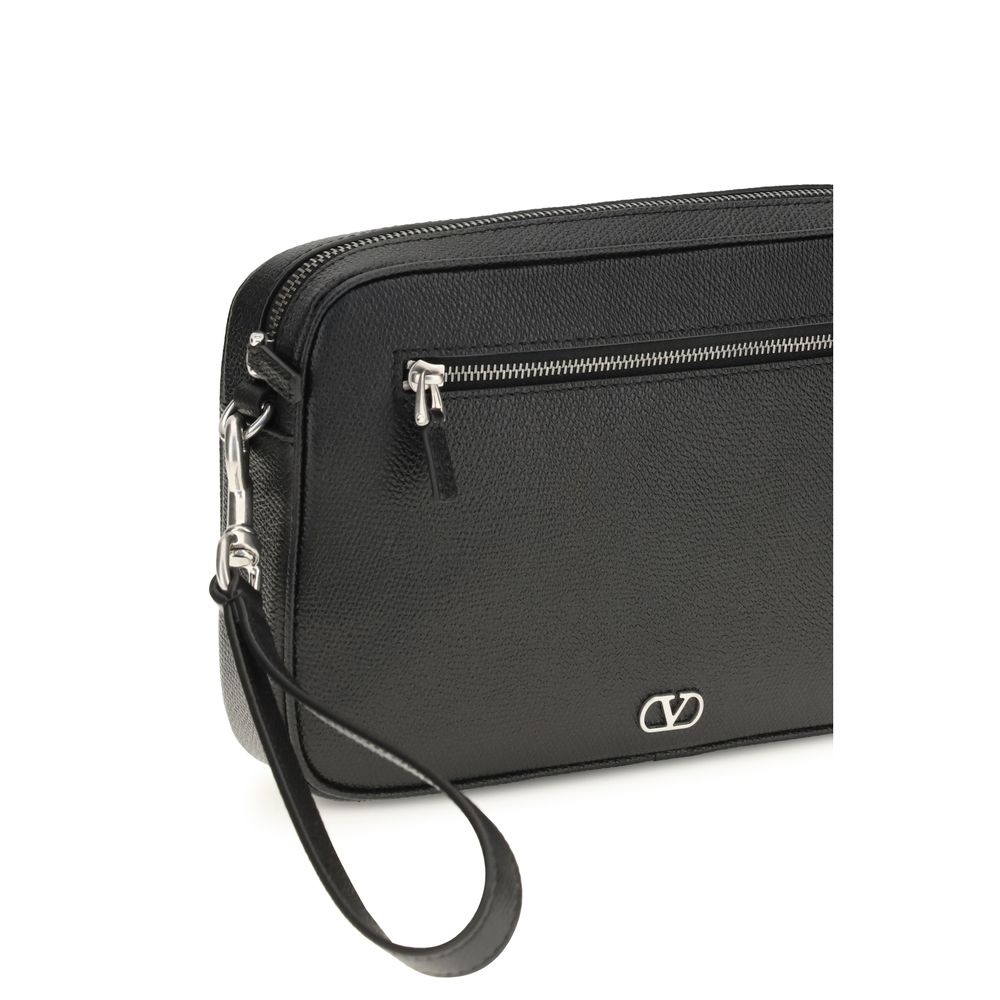 Valentino Garavani black calf leather Bos Taurus handbag with gold hardware and structured design.