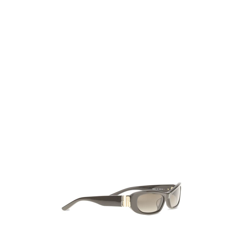 Balenciaga brown acetate sunglasses with rounded frames and dark tinted lenses on a neutral background.