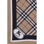 Burberry beige silk scarf with classic check pattern, lightweight and luxurious fabric, displayed flat on a neutral background.